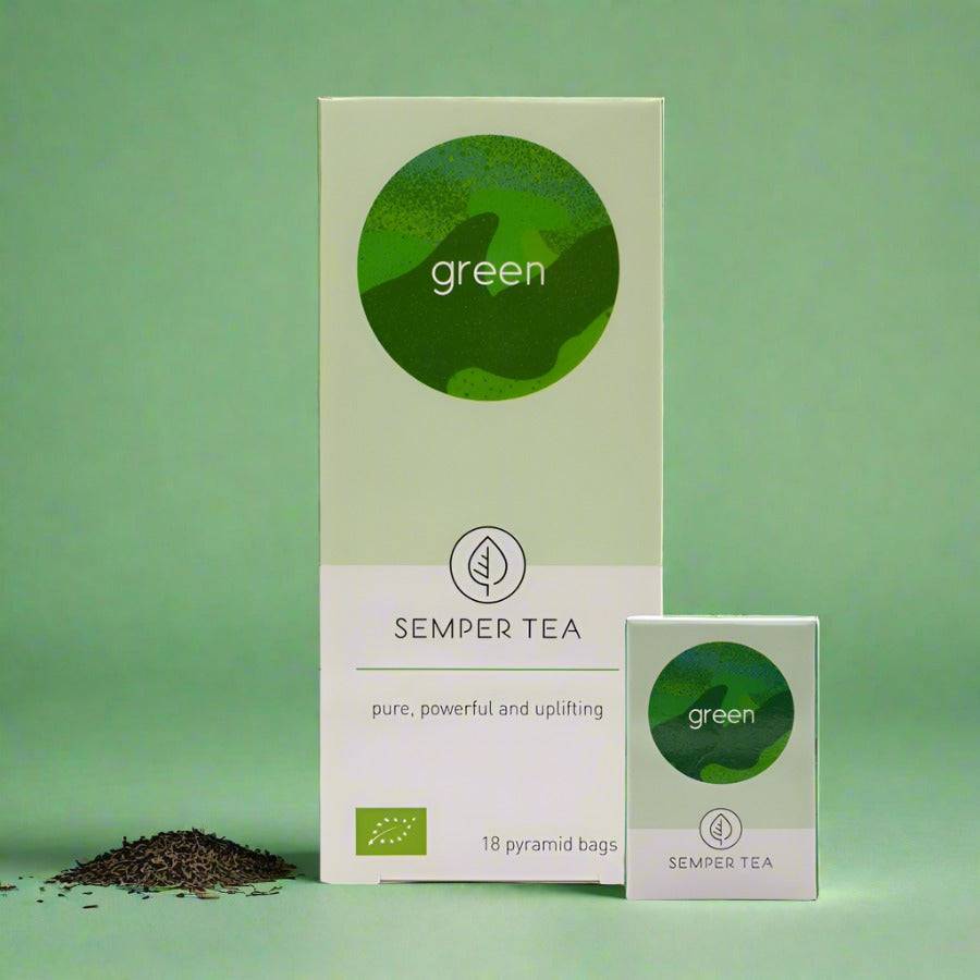 Caja de Semper Tea Verde con diseño verde y 18 bolsas de té piramidales.